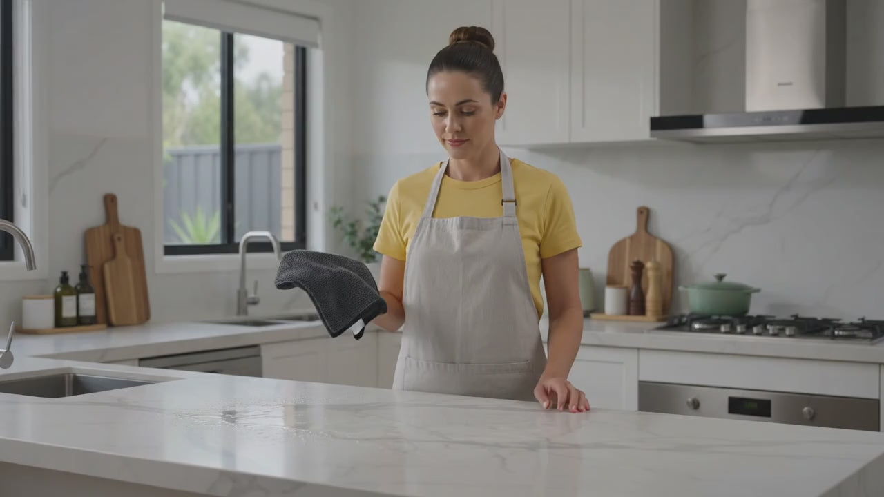 CleanSmart Water-Only Cloth wiping a marble benchtop clean with just water