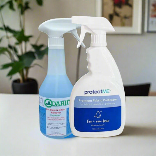 Two bottles of cleaning products, one labeled 'Odarid' and the other 'protectME', sitting on a table